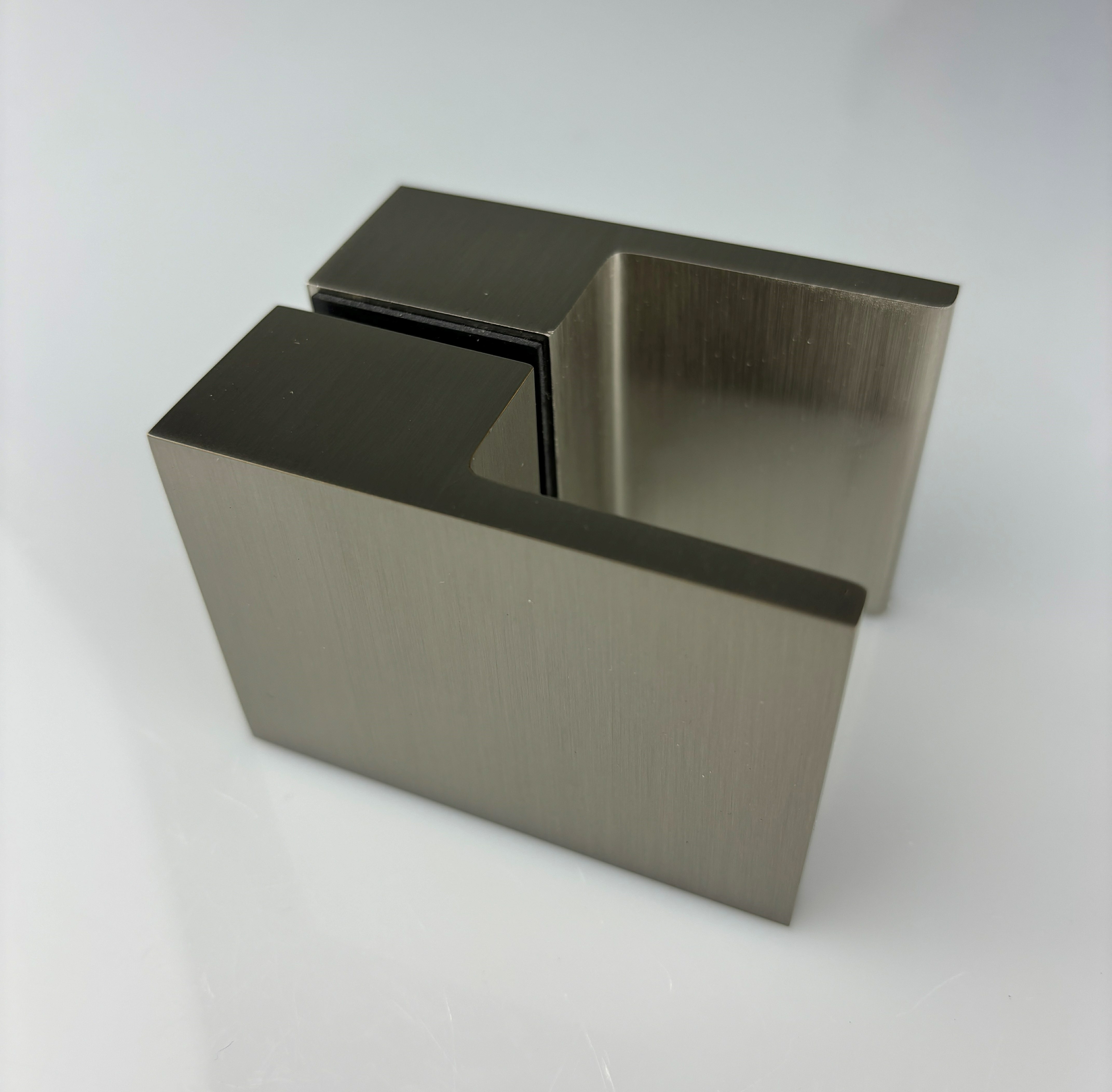 Close-up of brushed nickel shower door knob showing finish detail